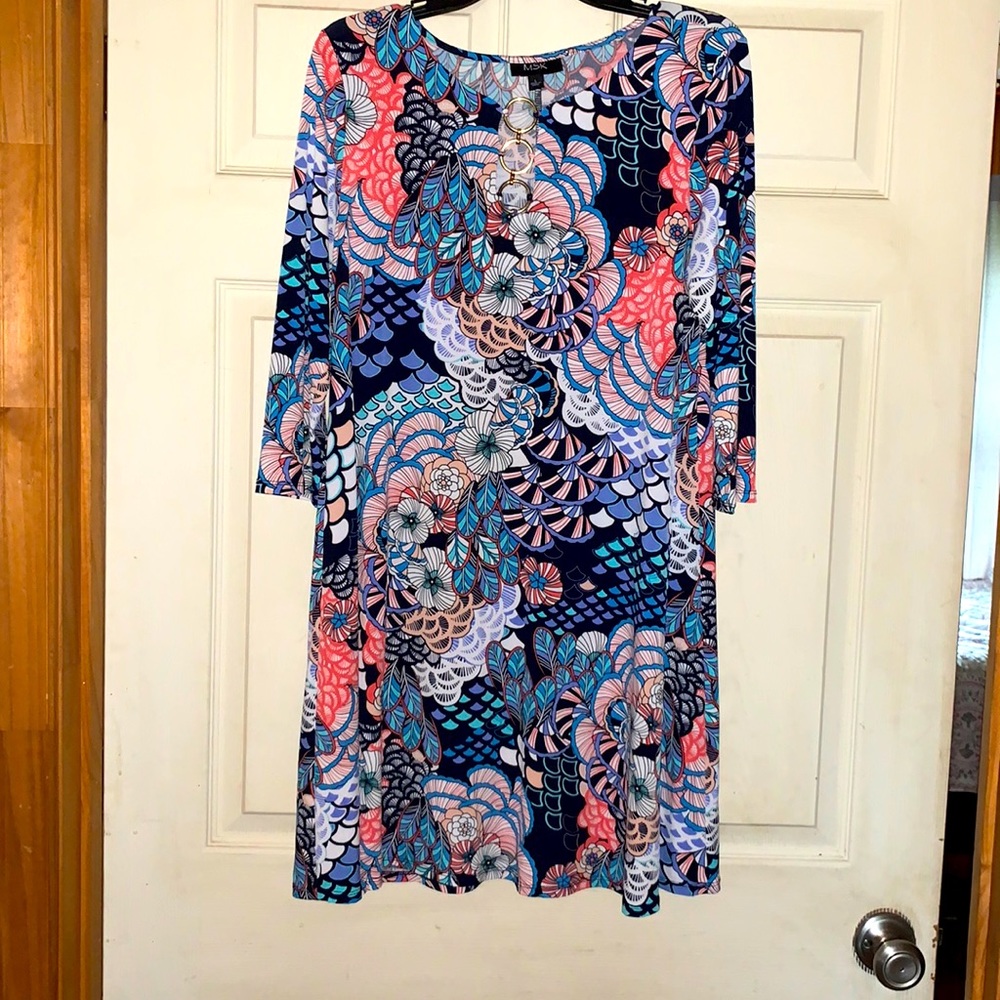 This multi print dress is made from 96% polyester and 4% spandex, super comfy!